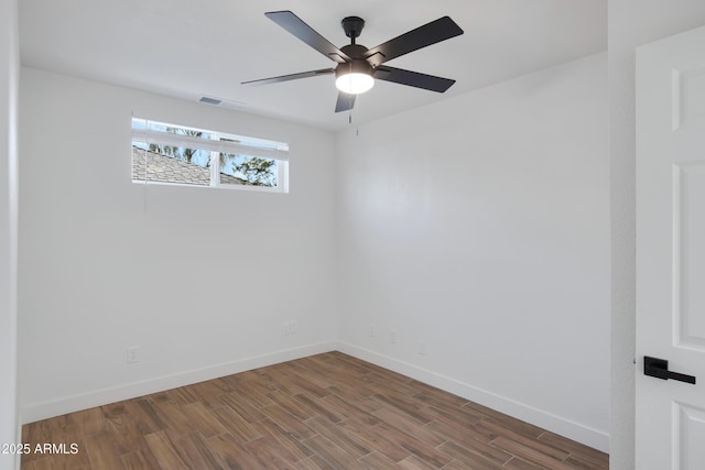 unfurnished room featuring ceiling fan and dark hardwood / wood-style floors