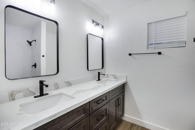 bathroom featuring vanity and hardwood / wood-style flooring