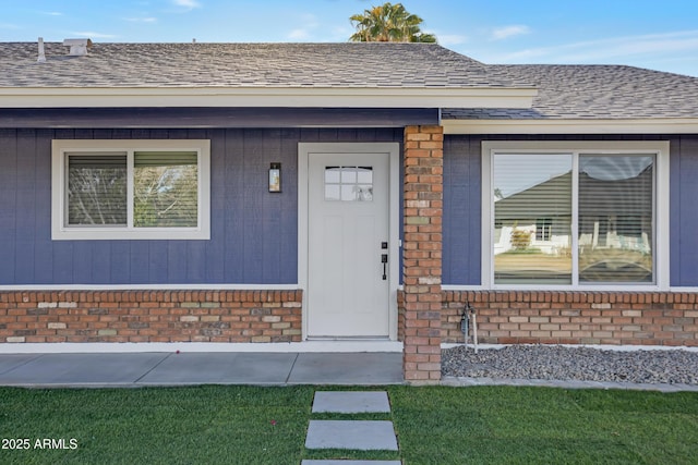 doorway to property featuring a yard