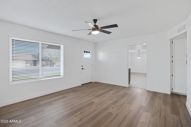 interior space with hardwood / wood-style flooring and ceiling fan