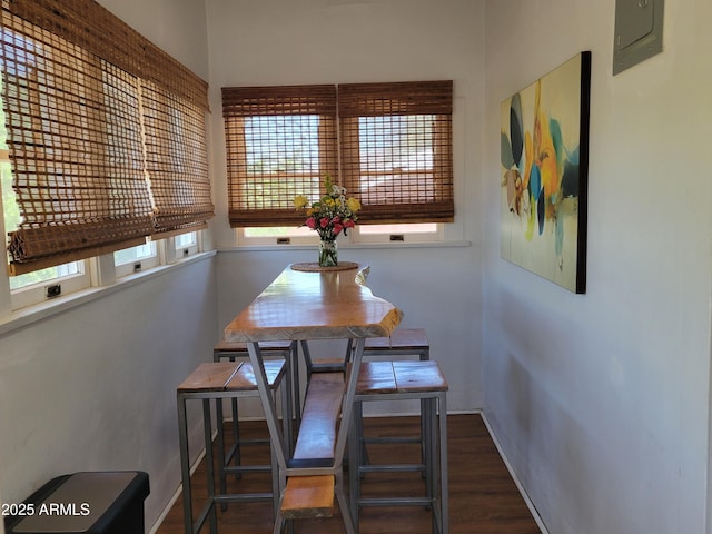 405 Powell St, Bisbee, AZ 85603 - dining space featuring wood finished floors, baseboards, and electric panel