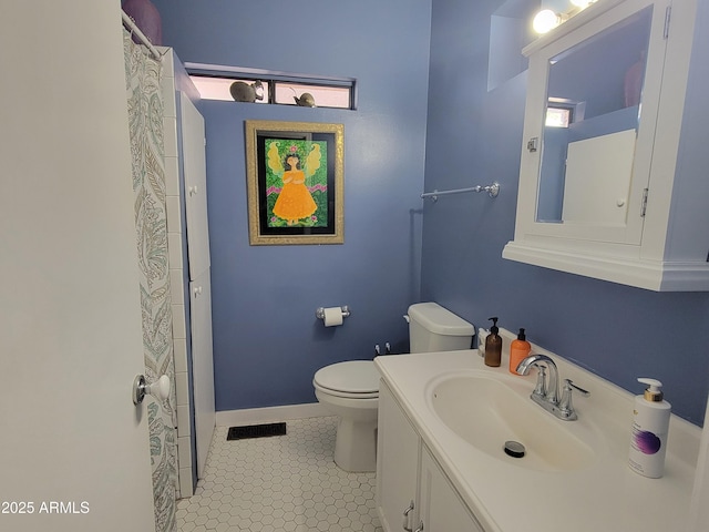 405 Powell St, Bisbee, AZ 85603 - full bathroom featuring toilet, vanity, tile patterned floors, baseboards, and curtained shower
