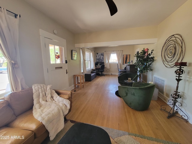 405 Powell St, Bisbee, AZ 85603 - living area featuring wood finished floors, an office area, and baseboards