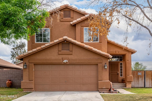 view of front of house with a tiled roof, driveway, and fence