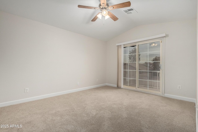 carpeted empty room featuring visible vents, lofted ceiling, baseboards, and ceiling fan