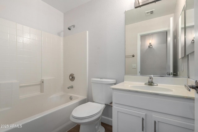 full bathroom featuring visible vents, tub / shower combination, toilet, and vanity