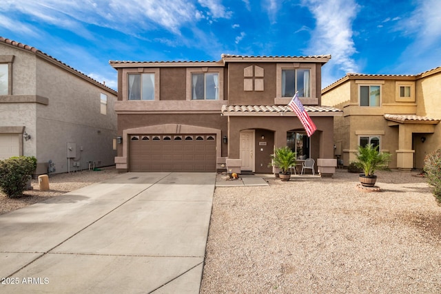 mediterranean / spanish-style home with a garage