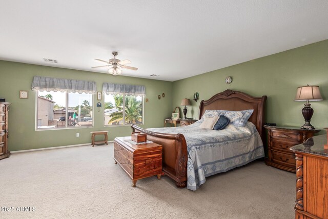 bedroom featuring light colored carpet and ceiling fan