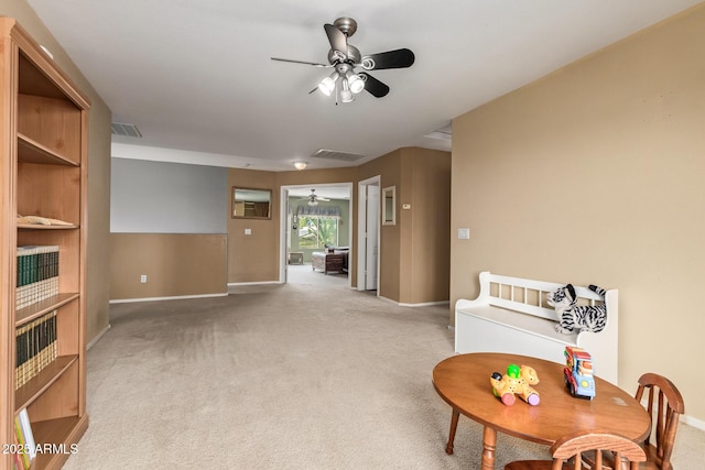 sitting room with light carpet and ceiling fan