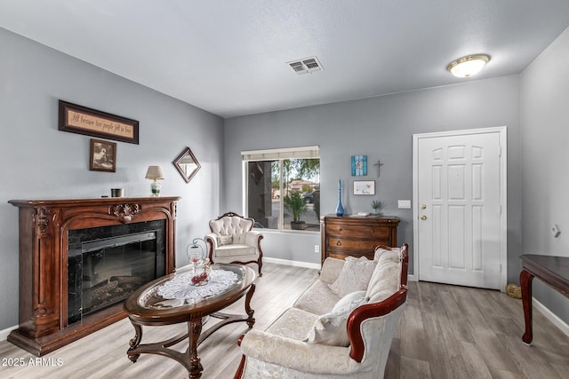 sitting room with light hardwood / wood-style floors