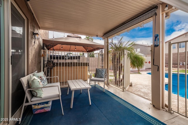 view of patio with a gazebo and a fenced in pool