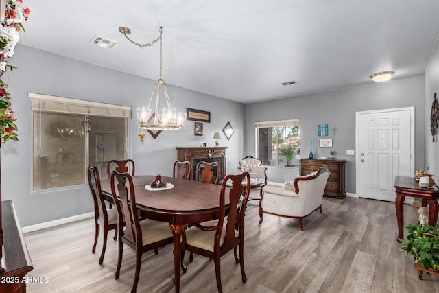 dining space with light wood-type flooring