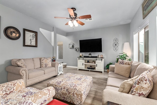 living room with ceiling fan and wood-type flooring