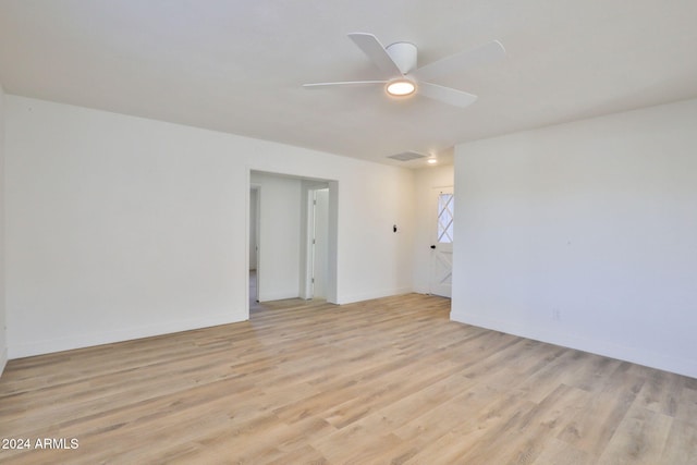 spare room with light hardwood / wood-style flooring and ceiling fan