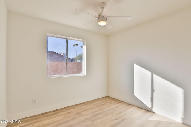 unfurnished room with ceiling fan and light wood-type flooring