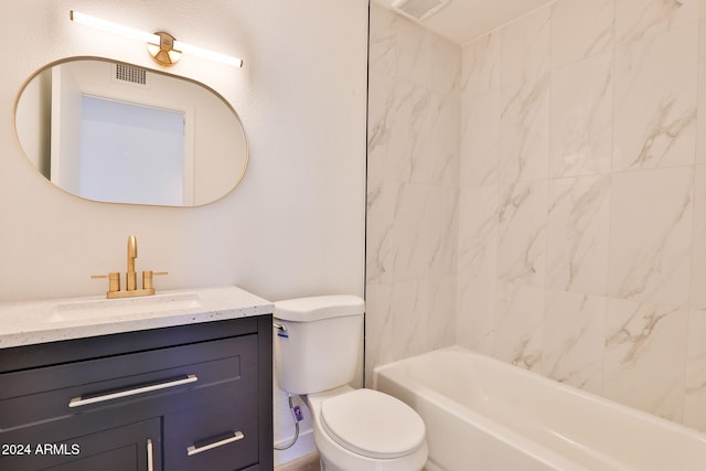 full bathroom with vanity, toilet, and tiled shower / bath combo