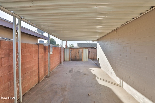 view of patio with a storage shed