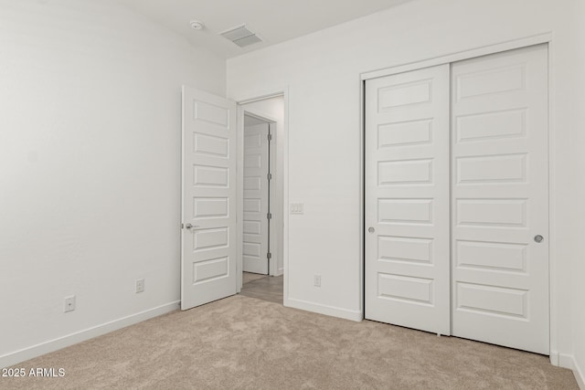 19151 W Coolidge St, Litchfield Park, AZ 85340 - unfurnished bedroom with carpet floors, a closet, and baseboards