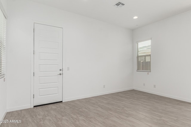 19151 W Coolidge St, Litchfield Park, AZ 85340 - spare room featuring baseboards, recessed lighting, and light wood-style flooring