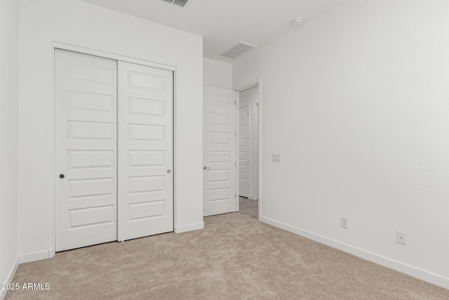 19151 W Coolidge St, Litchfield Park, AZ 85340 - unfurnished bedroom with light colored carpet, a closet, and baseboards