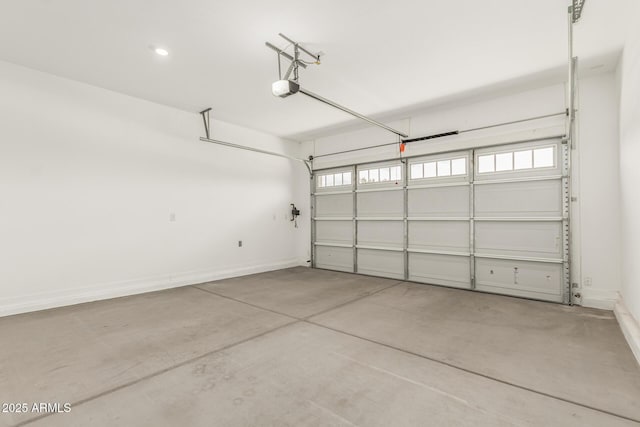 19151 W Coolidge St, Litchfield Park, AZ 85340 - garage with baseboards and a garage door opener