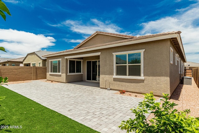 19151 W Coolidge St, Litchfield Park, AZ 85340 - rear view of house with a patio, stucco siding, a fenced backyard, and central AC unit