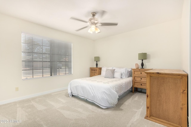 bedroom featuring ceiling fan and light colored carpet