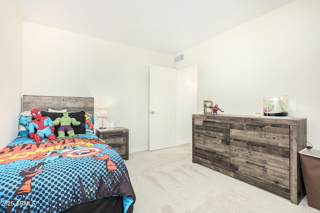 bedroom with light colored carpet