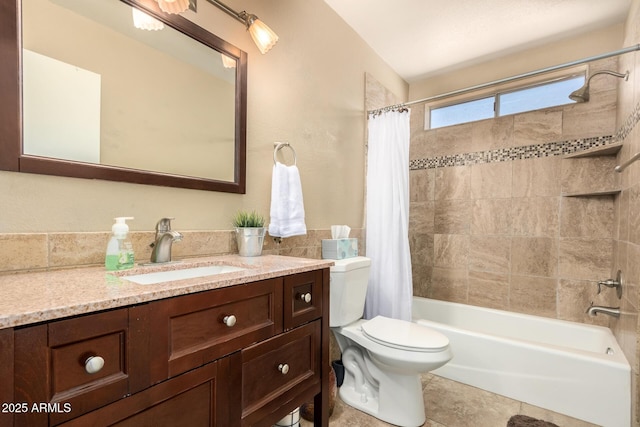 full bathroom with toilet, vanity, tile patterned floors, and shower / bath combination with curtain