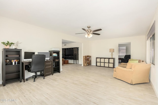 office area featuring ceiling fan and light hardwood / wood-style floors