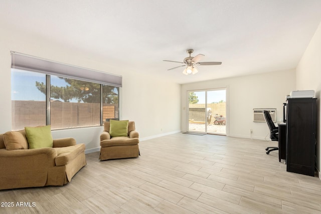 office area with an AC wall unit and ceiling fan