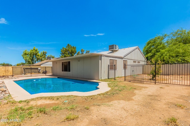 view of swimming pool featuring central AC unit