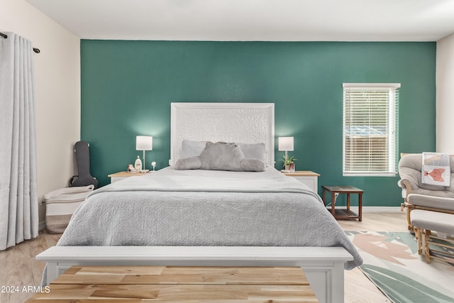 bedroom with light hardwood / wood-style flooring