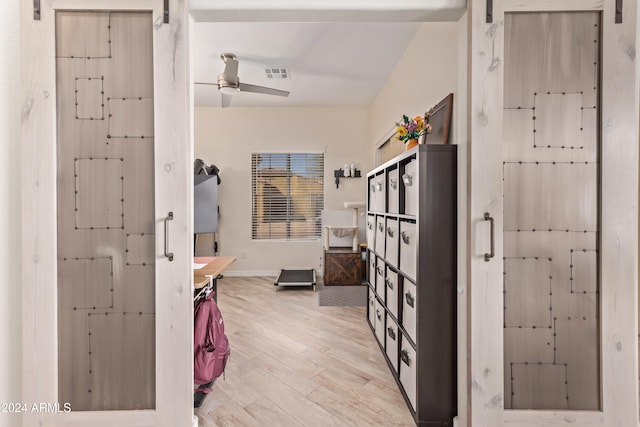 bathroom featuring wood-type flooring and ceiling fan