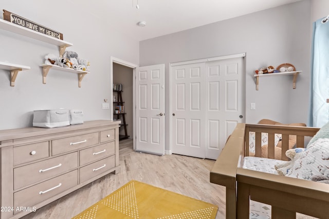 bedroom featuring light hardwood / wood-style flooring and a closet