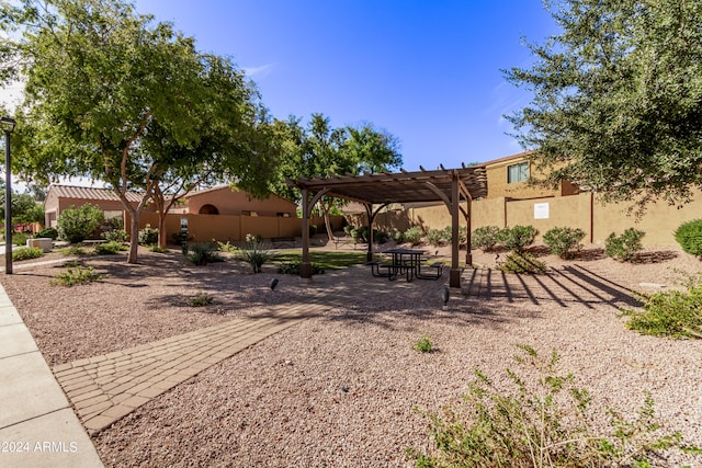 view of yard with a pergola and a patio