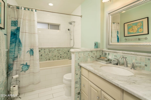 full bathroom featuring shower / tub combo with curtain, tile patterned flooring, vanity, and toilet