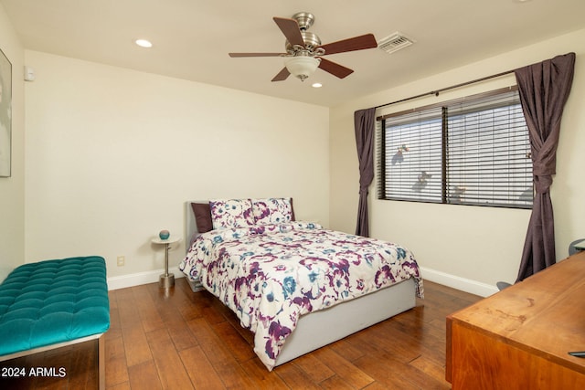 bedroom with ceiling fan and dark hardwood / wood-style flooring