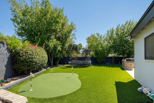 view of yard with a trampoline