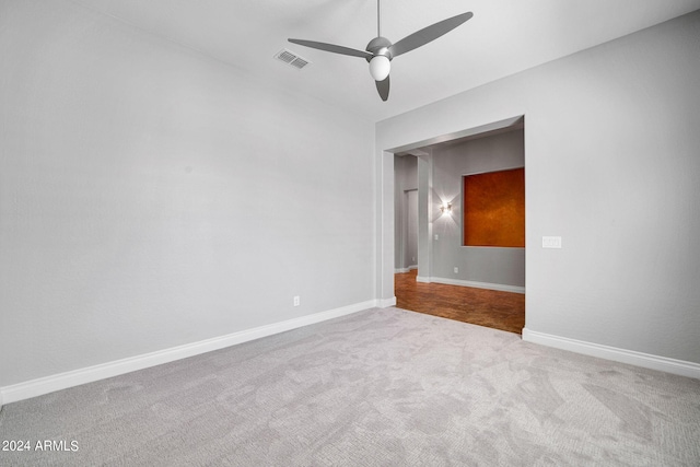 carpeted empty room with ceiling fan