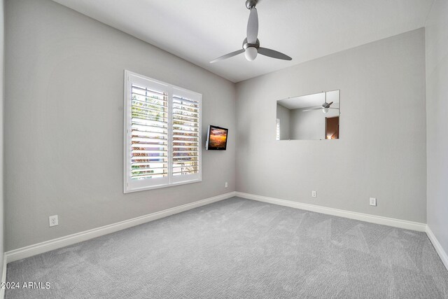 carpeted empty room with ceiling fan