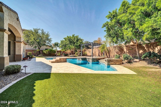 view of swimming pool with a yard, a patio area, and a pergola