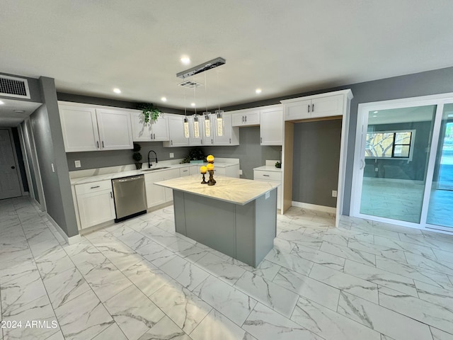 kitchen with a center island, sink, pendant lighting, white cabinetry, and dishwasher