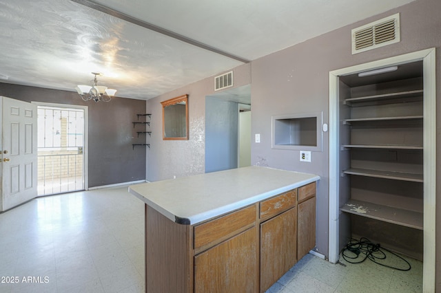 kitchen featuring a notable chandelier