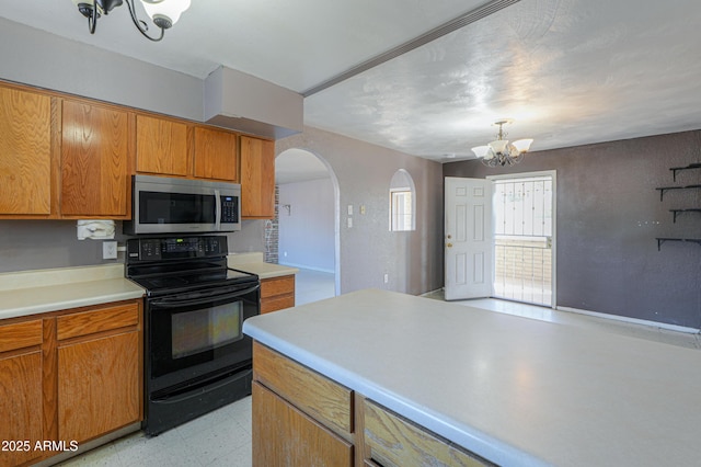 kitchen with an inviting chandelier and black range with electric cooktop