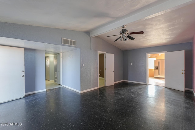 spare room with lofted ceiling with beams and ceiling fan