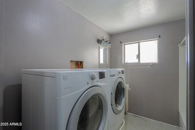 laundry area with washing machine and dryer