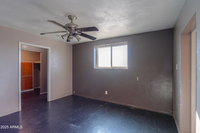 spare room featuring ceiling fan