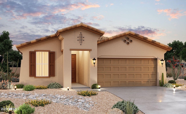 mediterranean / spanish house featuring a garage