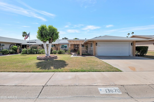 ranch-style house with a garage, a front yard, and driveway